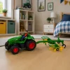 Távirányítású mezőgazdasági traktor szénagereblyével RC lámpákkal 1:24